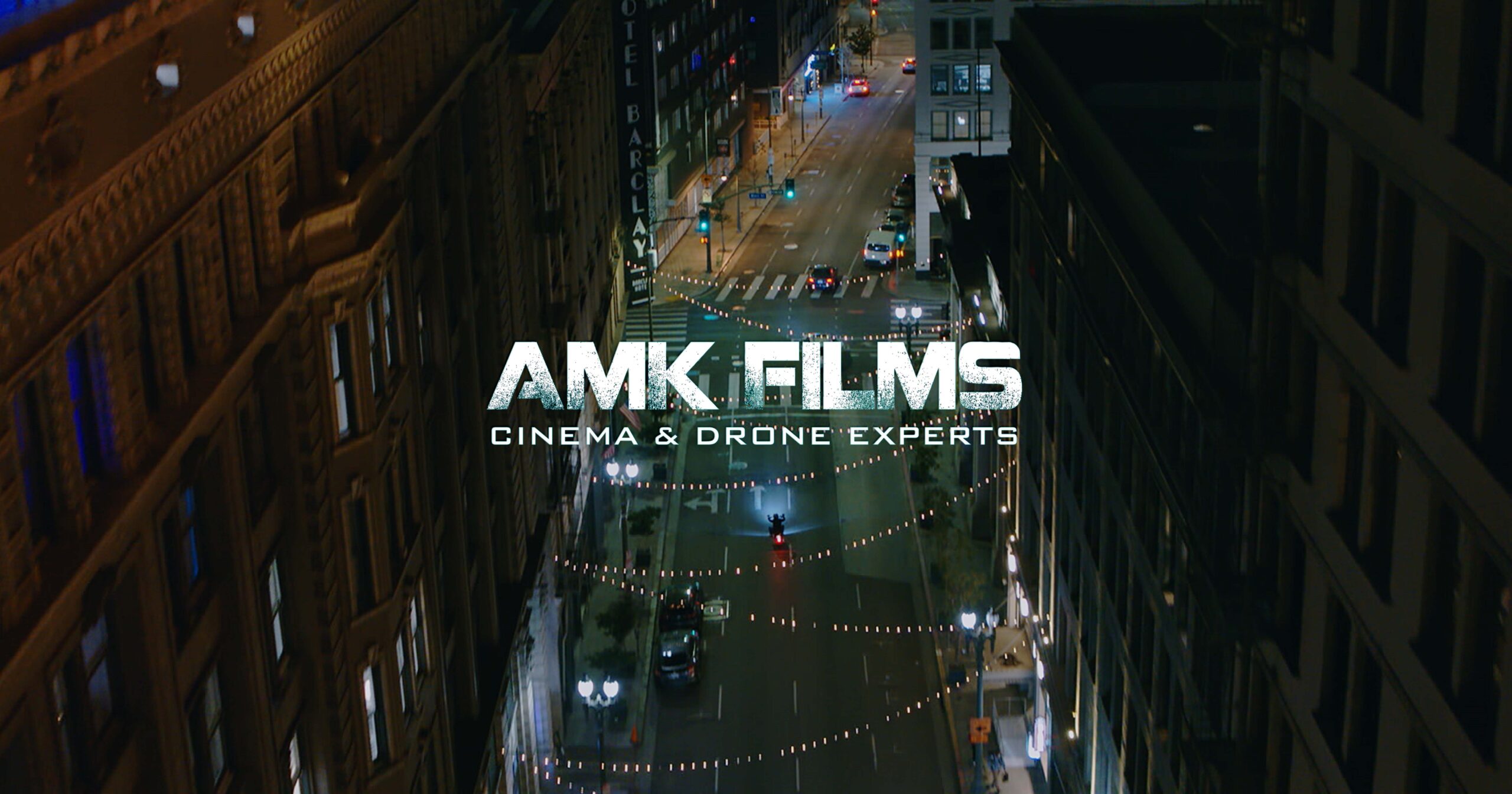 Aerial view of the Arts District in downtown Los Angeles with the AMK Films logo overlay, captured in 2022.