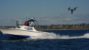 A behind-the-scenes shot of AMK Films capturing Willard Marine vessels in the Long Beach Pacific Ocean area. Pilot Aaron Kahn operates the DJI Inspire 2, while camera operator Hrant Gulesserian ensures dynamic visuals, showcasing the precision and teamwork behind this exciting production.