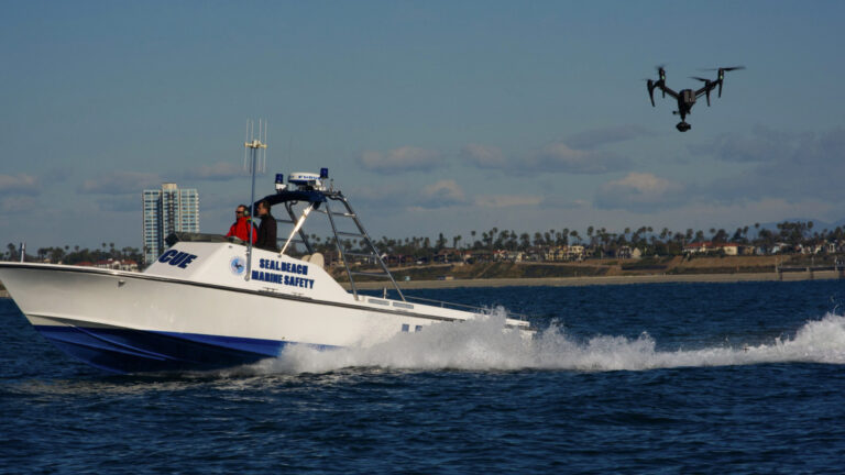 A behind-the-scenes shot of AMK Films capturing Willard Marine vessels in the Long Beach Pacific Ocean area. Pilot Aaron Kahn operates the DJI Inspire 2, while camera operator Hrant Gulesserian ensures dynamic visuals, showcasing the precision and teamwork behind this exciting production.