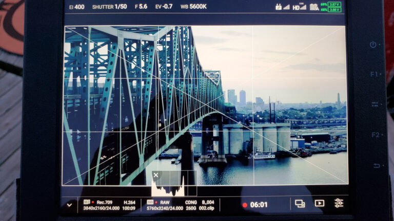 A behind-the-scenes glimpse of aerial cinematography on set near the Maurice J. Tobin Memorial Bridge in Boston, Massachusetts.