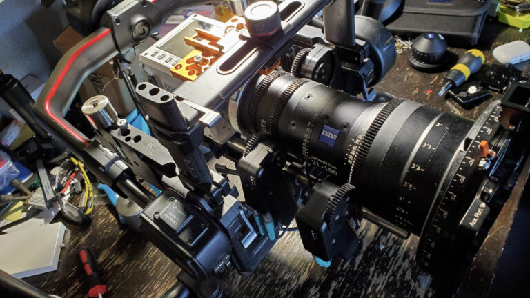 A close-up shot of the AMK Films camera setup featuring the DJI Ronin 2, RED Camera, and a Zeiss Zoom 21-100mm lens, mounted on the Alta X drone. The crew prepares for an intricate shoot for the Anduril Ghost project, highlighting cutting-edge technology and precision filmmaking.